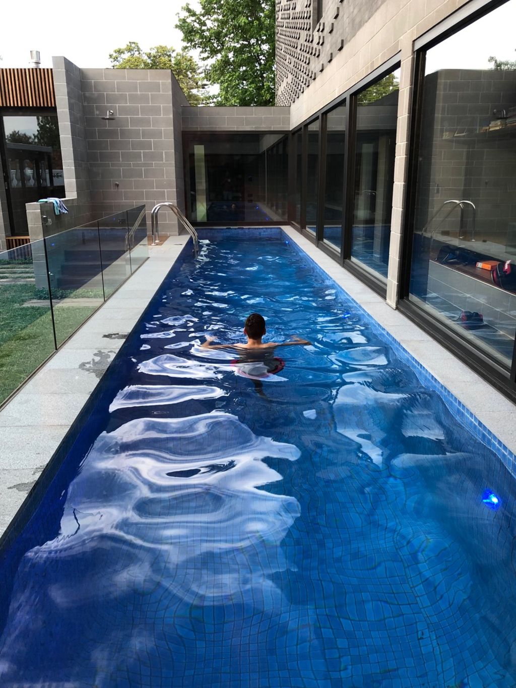 The lap pool is set at the heart of the house. Photo: Ben Hosking