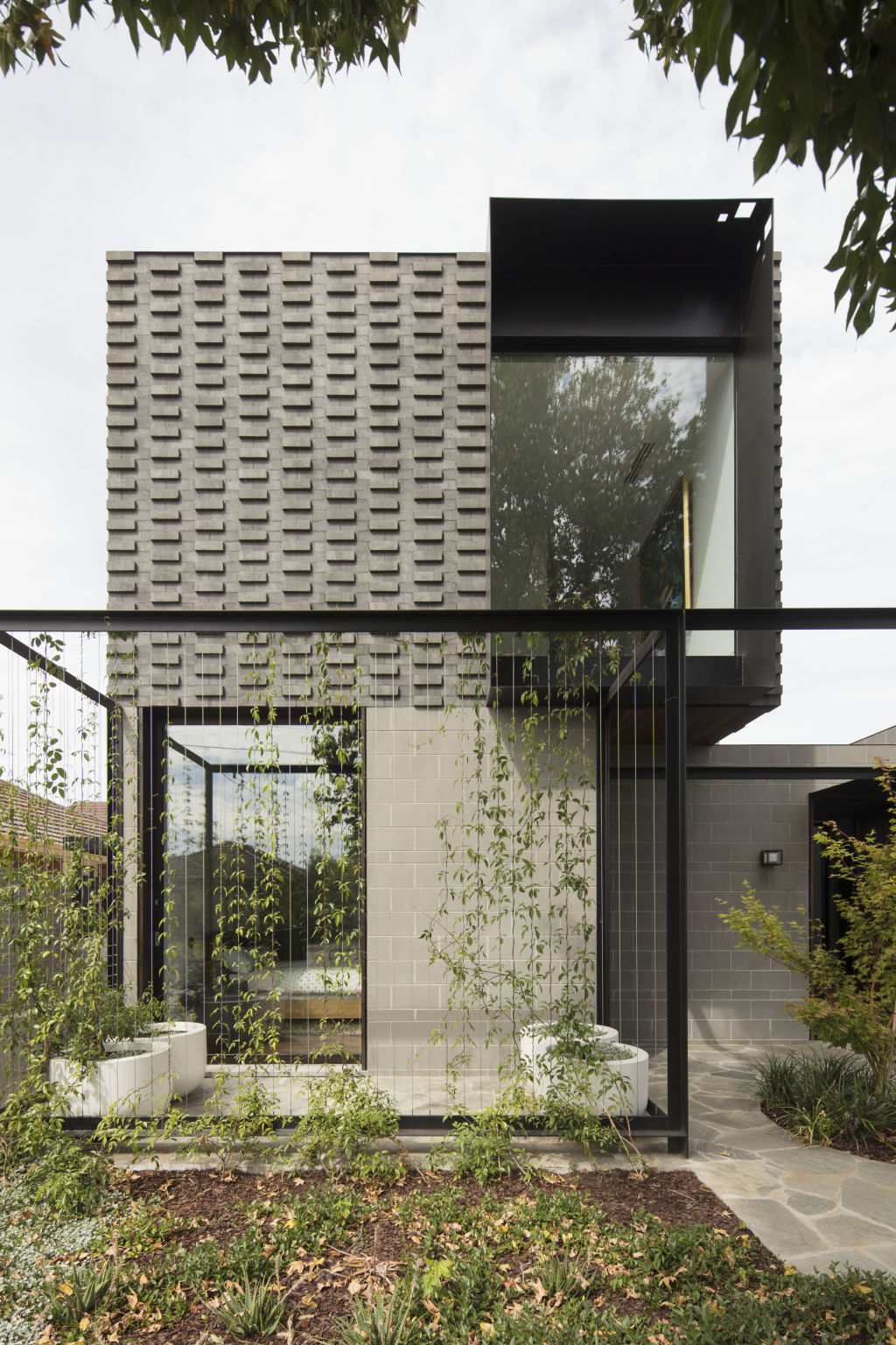 The two-level, grey brick house in Strathmore. Photo: Ben Hosking