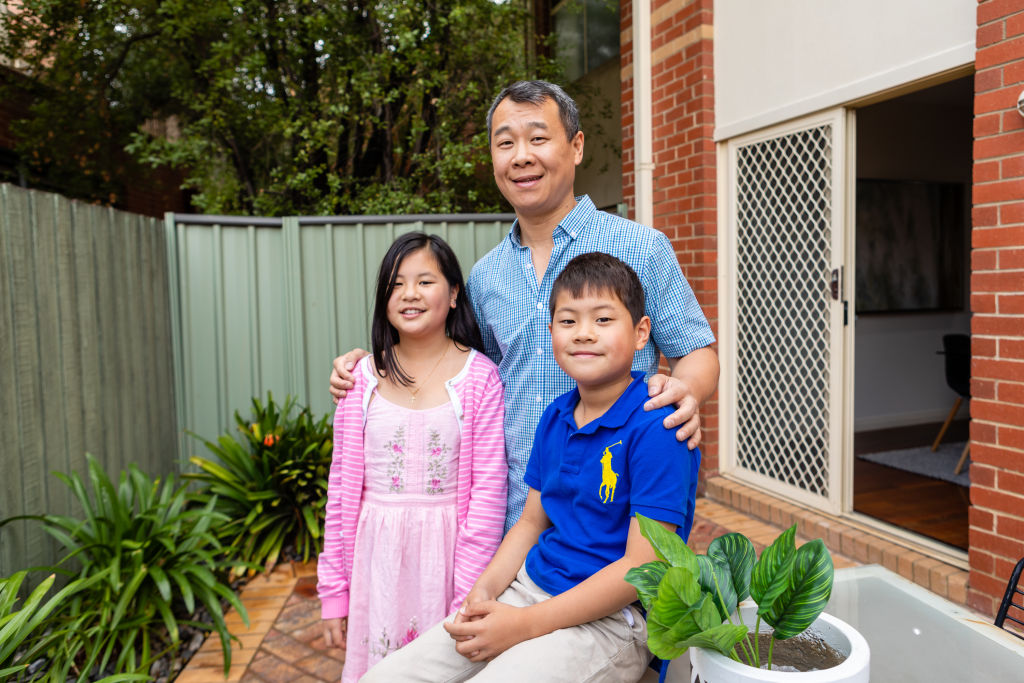 Brandon Truong and his children Evan and Jaslyn at the Flemington home he is selling. Photo: Greg Briggs