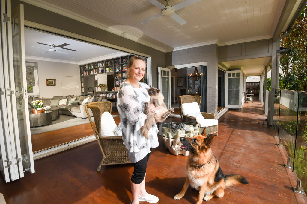 Lindfield seller Vicky Culver, with her cat Fergus and dog Gretel. Photo: Peter Rae
