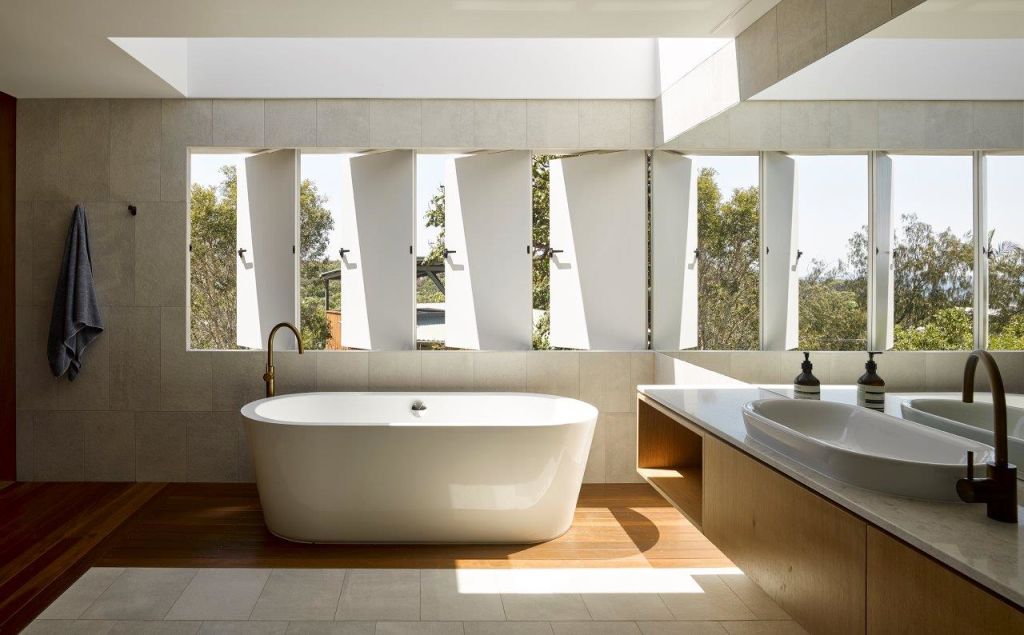 Blade windows deliver privacy to the bathroom, the mirror reflects the wanted view. Photo: Christopher Frederick Jones