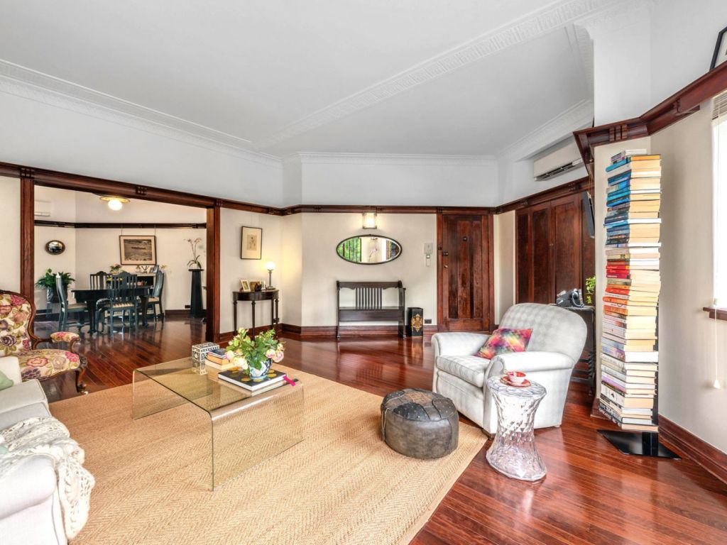 Beautiful art deco features abound but the apartment is also incredibly spacious. Photo: Ray White New Farm