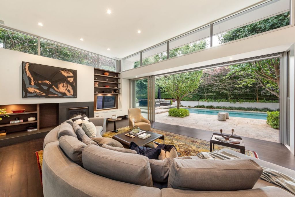 The living area opens out to an outdoor entertaining space. Photo: Kay & Burton South Yarra