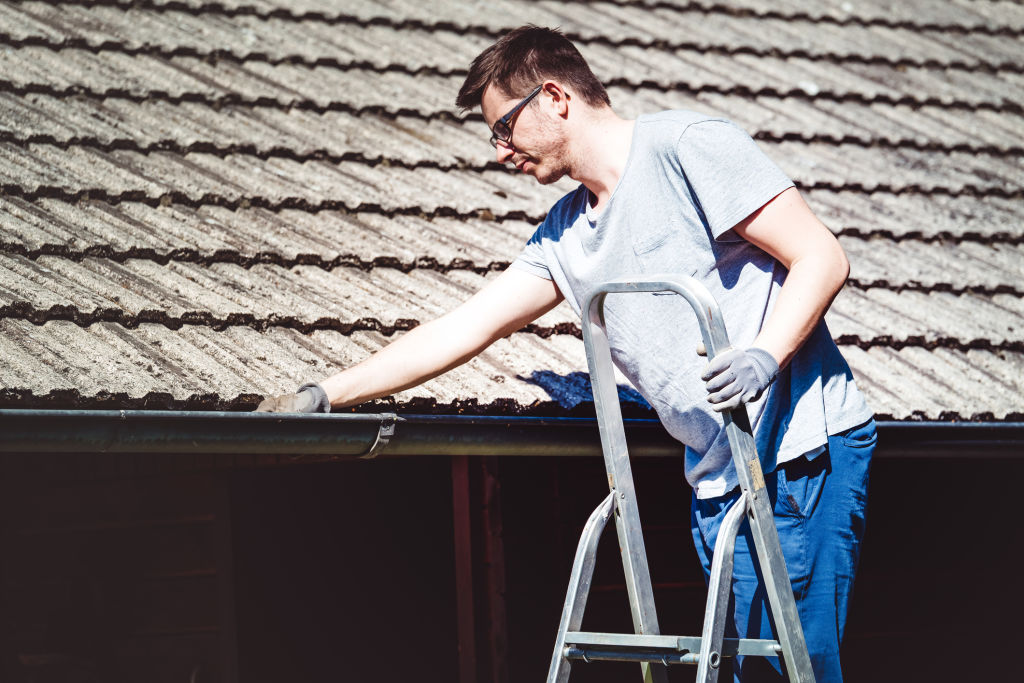 Take care when climbing a ladder or accessing the roof to clean gutters. Photo: iStock