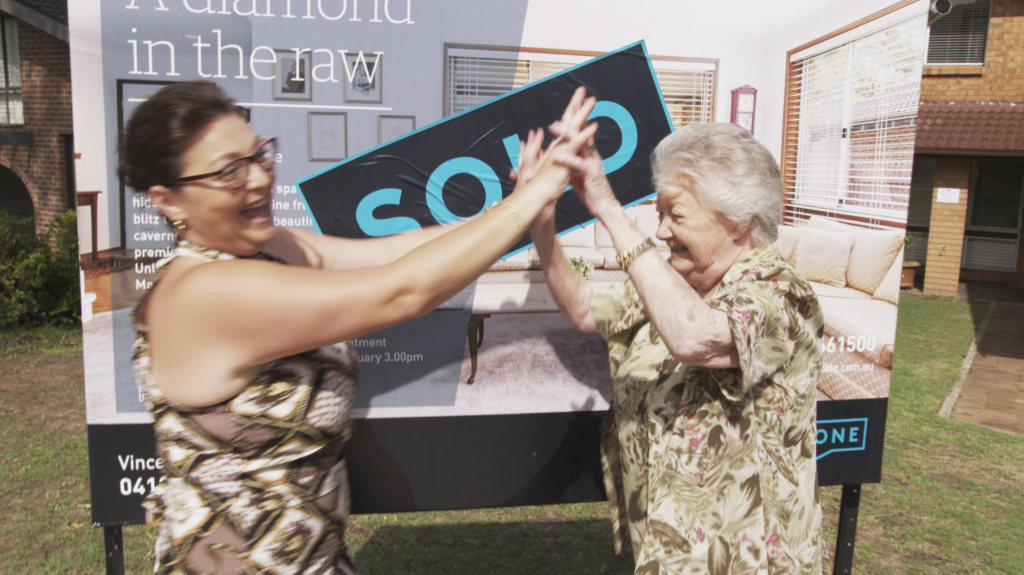 An end of an era: Vivian and Anne celebrate the successful auction. Photo: Your Domain