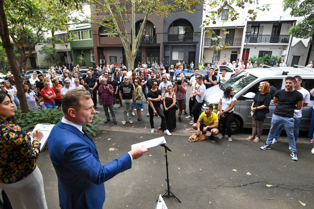 Mark Foy of Belle Property, did not have to wait long for an opening bid. Photo: Peter Rae.