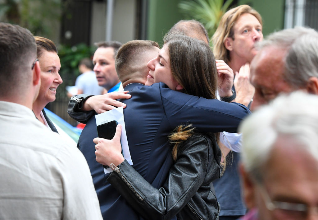 The winning bidder is congratulated after the fall of the hammer. Photo: Peter Rae