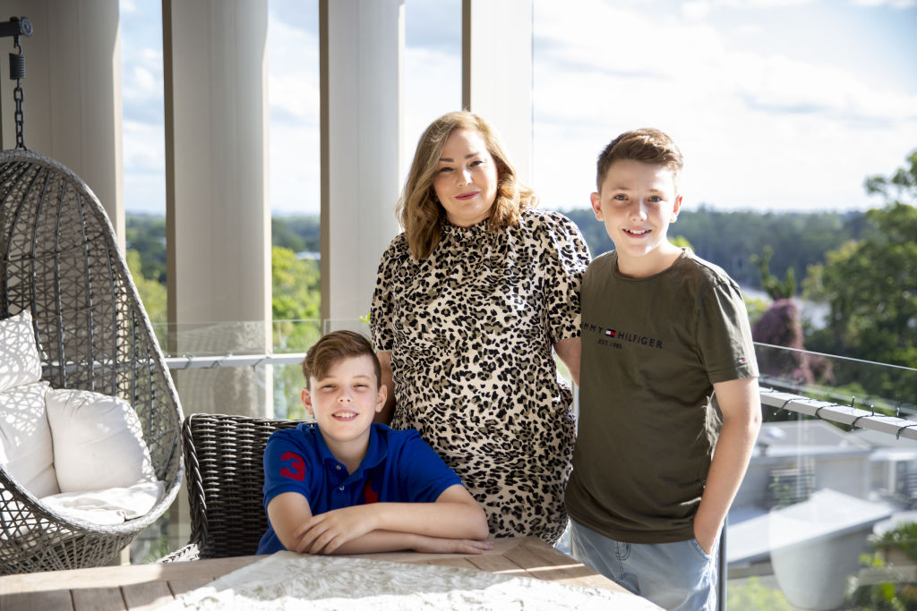 Aidan, Dylan and Melissa Williams of Indooroopilly, in Brisbane, moved from a six-bedroom home on acreage to a spacious apartment and couldn't be happier. Photo: Tammy Law