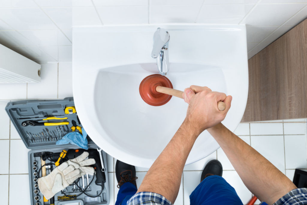 Save a call to the plumber by unclogging sinks and drains regularly. Photo: iStock
