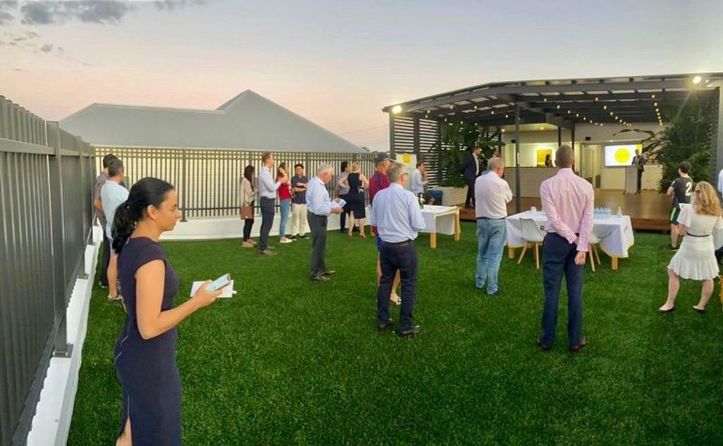 Buyers kept their distance at a midweek auction last week, which was held on a rooftop by Ray White Sherwood. Photo: Supplied