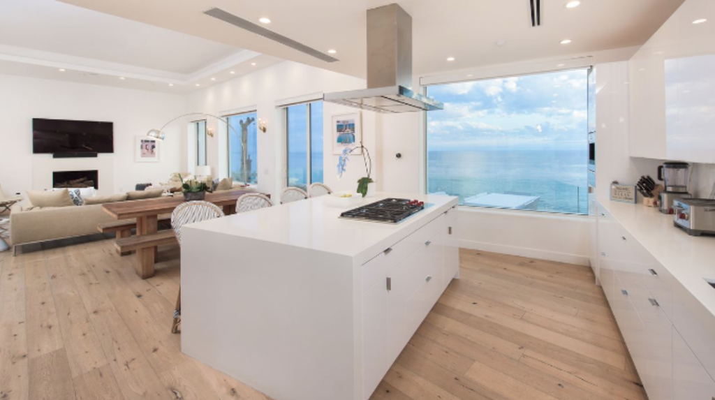 The property features an open-plan living and a chef's kitchen. Photo: Concierge Auctions