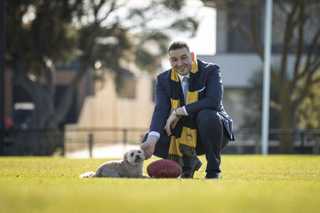 Steven Tabban, real estate agent and Brimbank council hopeful, with his dog Lulu at Sunshine Kangaroos Football Club in Sunshine, Melbourne. Photo: Daniel Pockett
