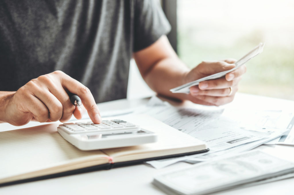 Crunching the numbers is essential in the home ownership process.  Photo: iStock