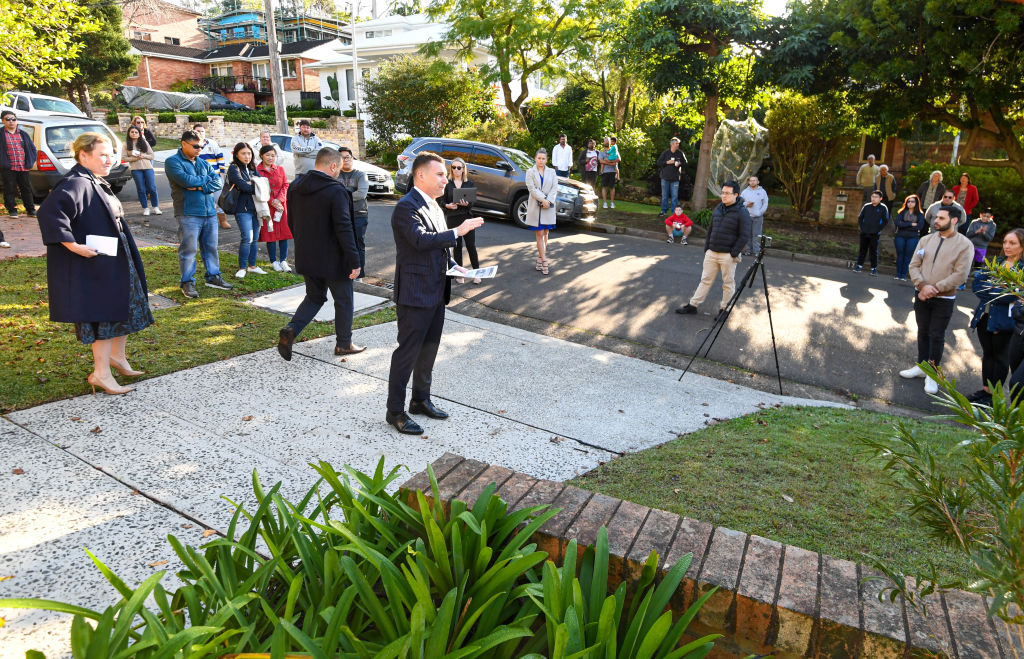 Domain Saturday Auction Sydney. Story by Tawar Razaghi - Auction by The Agency North of a 3 bedroom family home at 19 Holland Street, North Epping. Photo shows, The Agency auctioneer Thomas McGlynn during the auction. Photo by Peter Rae. Saturday 20 June 2020.