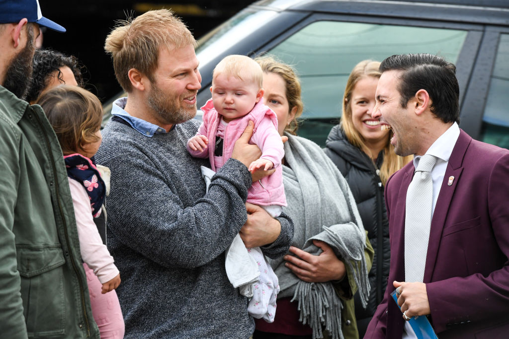 The happy vendors are congratulated by NG Farah agent, Mitchell Farah after the successful auction. Photo: Peter Rae