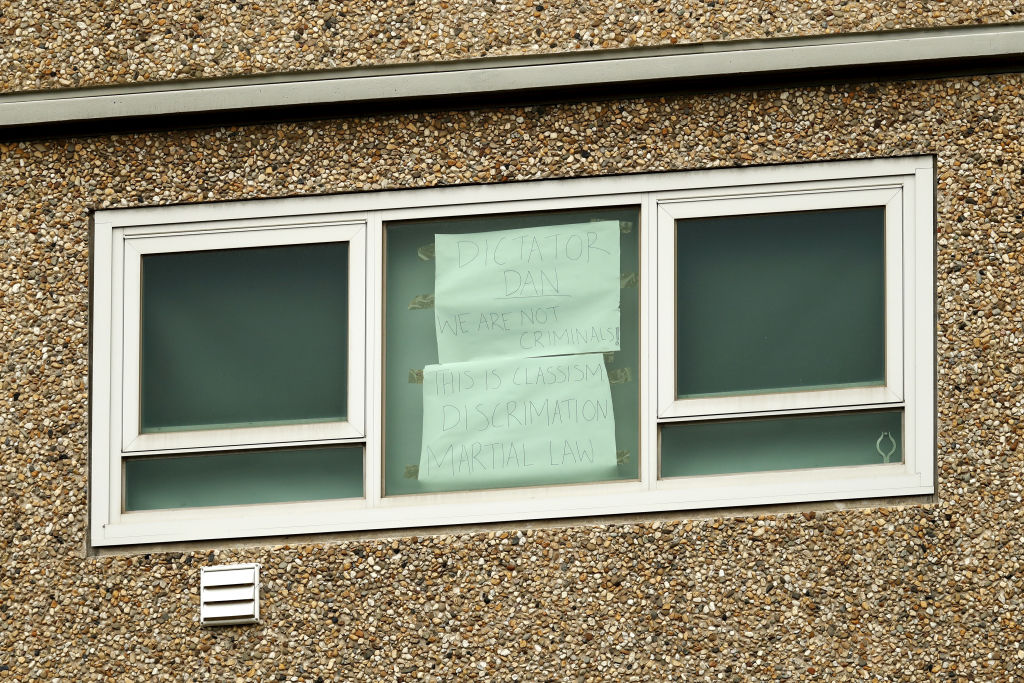 A sign is seen in the window at the Flemington towers July 5 , 2020. Photo: Darrian Traynor