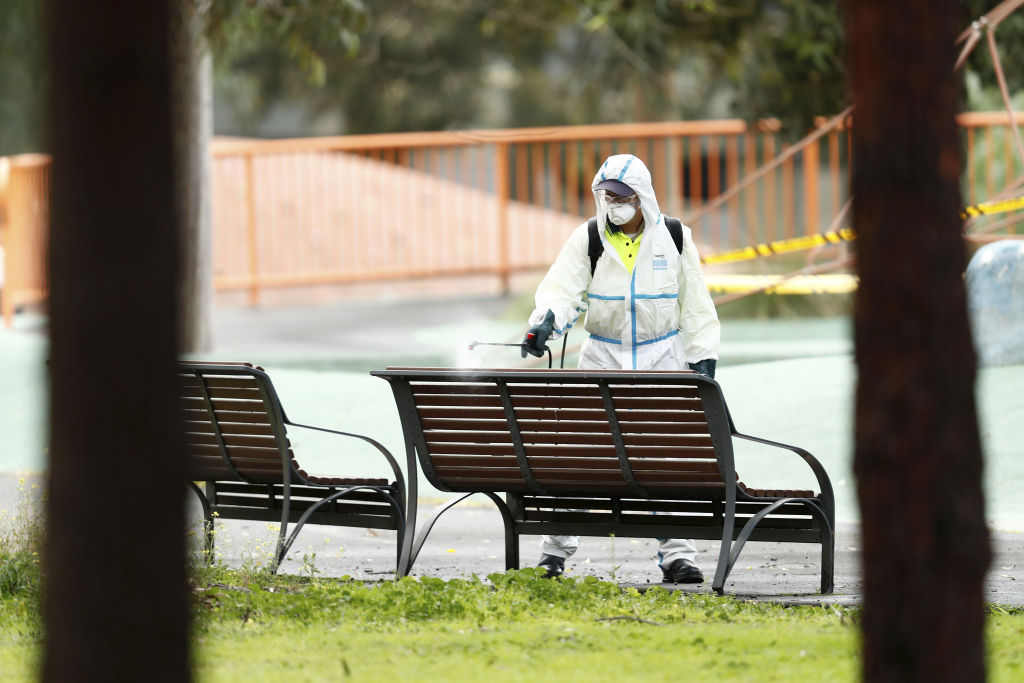 Sanitation takes place outside public housing in Flemington. Photo: Darrian Traynor