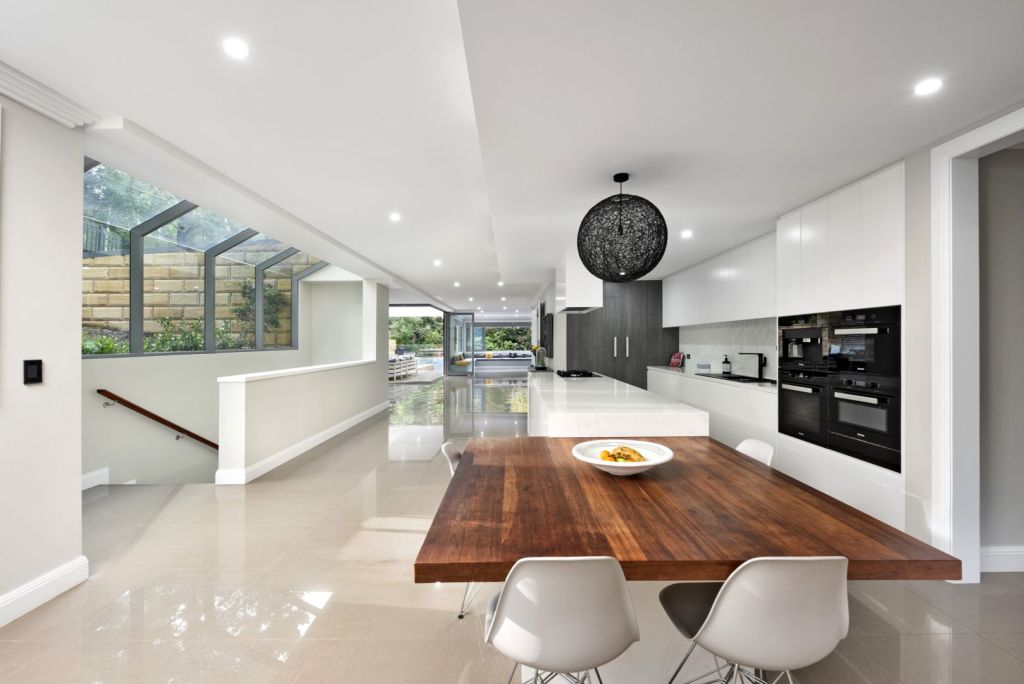The kitchen has integrated appliances including an espresso machine. Photo: Supplied