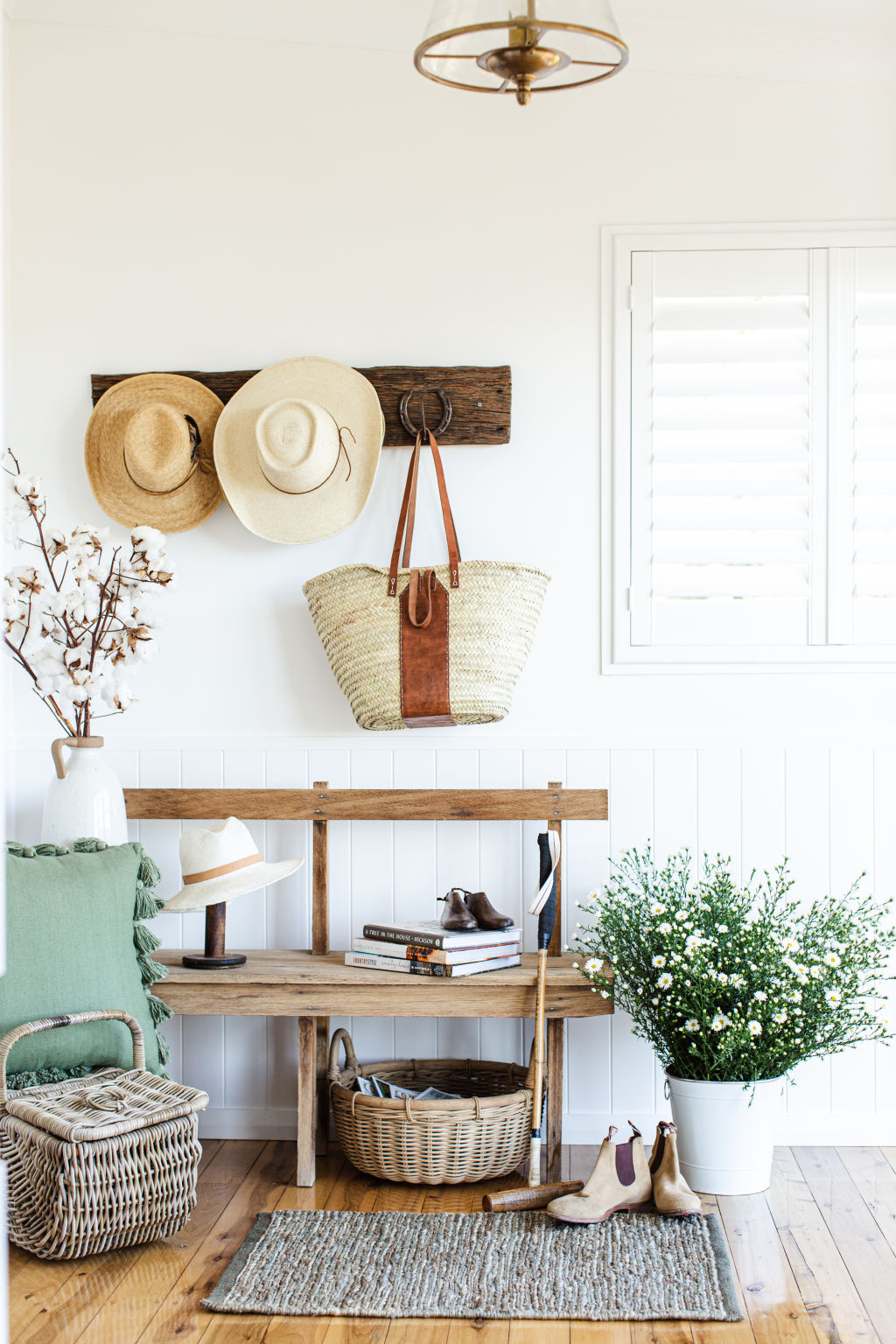 Organised zones in an entryway for a busy family's belongings in The Design Paddock's bright and breezy Spring Ridge project. Photo: Sheri McMahon Photography