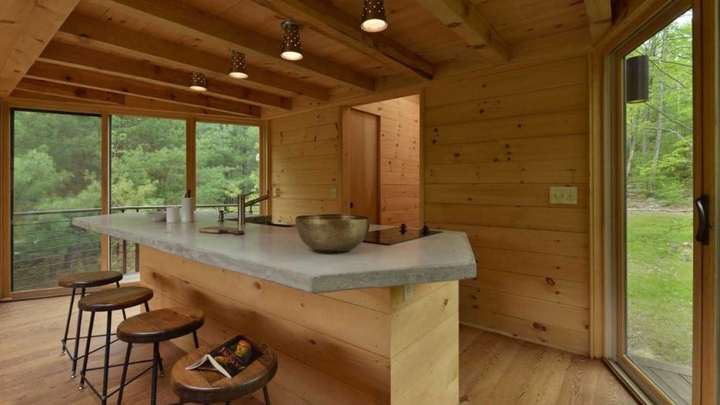 In the kitchen, the oven, cooktop and sink are all positioned within the island. Photo: Martin Dimitrov