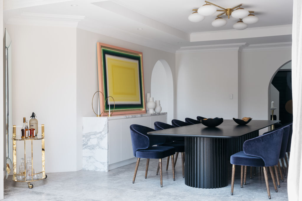 In the dining room, a Tomislav Nikolic painting perches atop a Calcutta marble buffet. Photo: Felix Forest