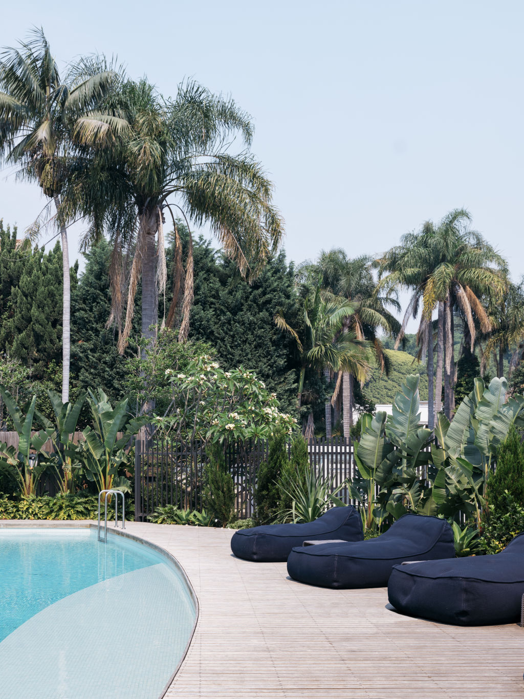 In the gardens, a crescent-shaped pool shimmers. Photo: Felix Forest
