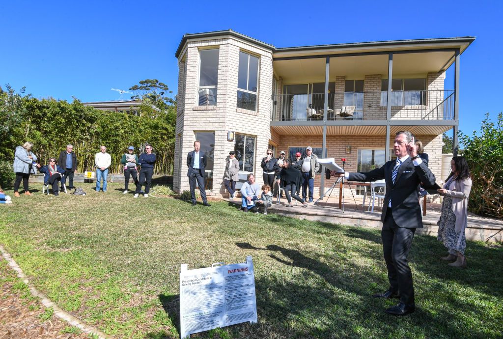 Domain Saturday Auction Sydney. Story by Elizabeth Redman- Auction by Drake Real Estate of a 5 bedroom family home at 3 Wesley Street, Elanora Heights Sydney. Photo shows, Auctioneer Jake Downs during the successful auction. Generic Covid 19 Social Distancing Warning signs Photo by Peter Rae. Saturday 22 August 2020.