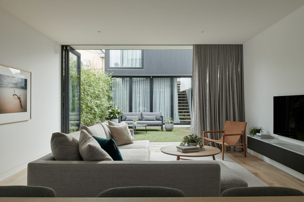An open-plan living area connects to a central courtyard. Photo: Simon Shiff