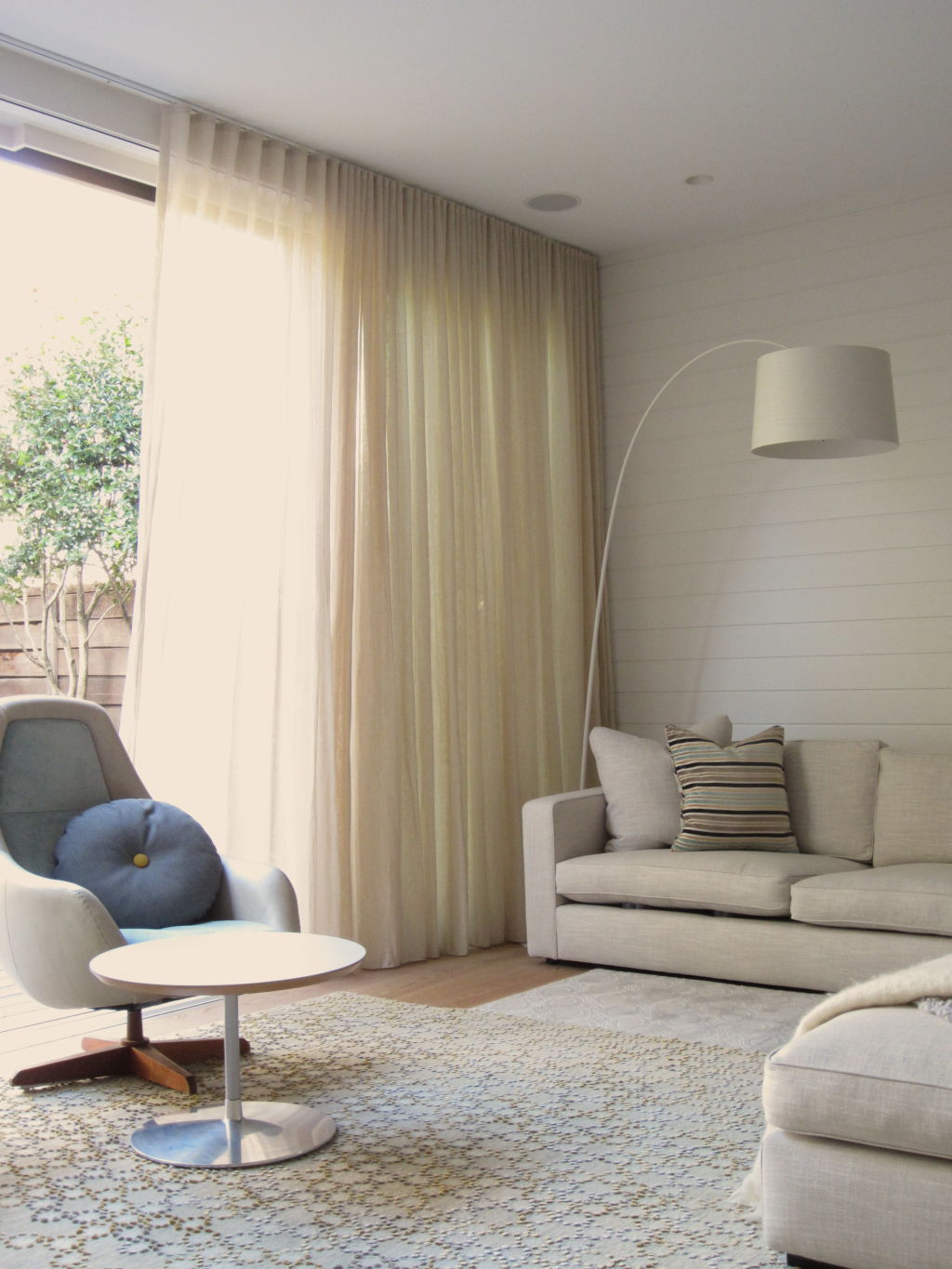 Try using floor lamps and layering rugs to create ambience. Photo: Amanda Prior