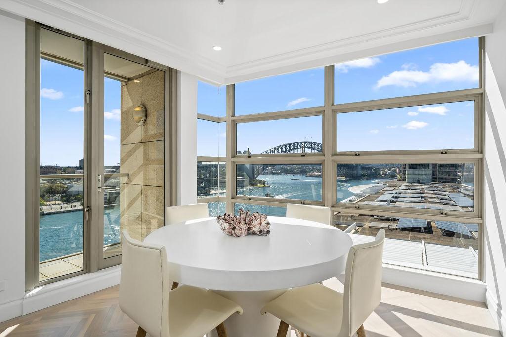 The kitchen opens up to a breakfast dining area with views of the Opera House. Photo: Supplied