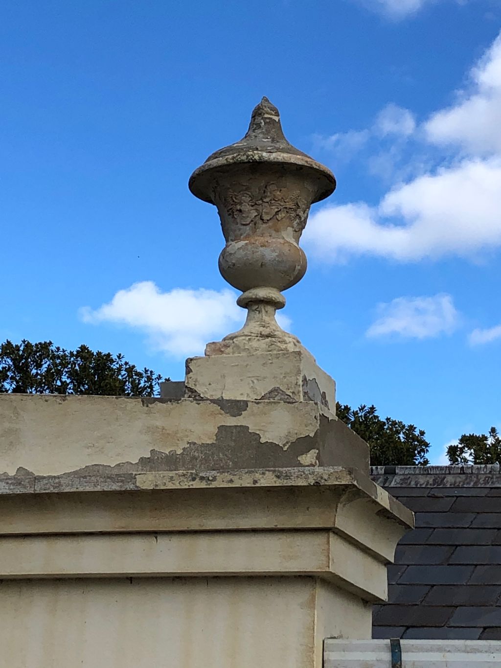 The parapet urns were revealed to be repurposed garden ornaments with previously unseen grape cluster detailing. Photo: National Trust Victoria