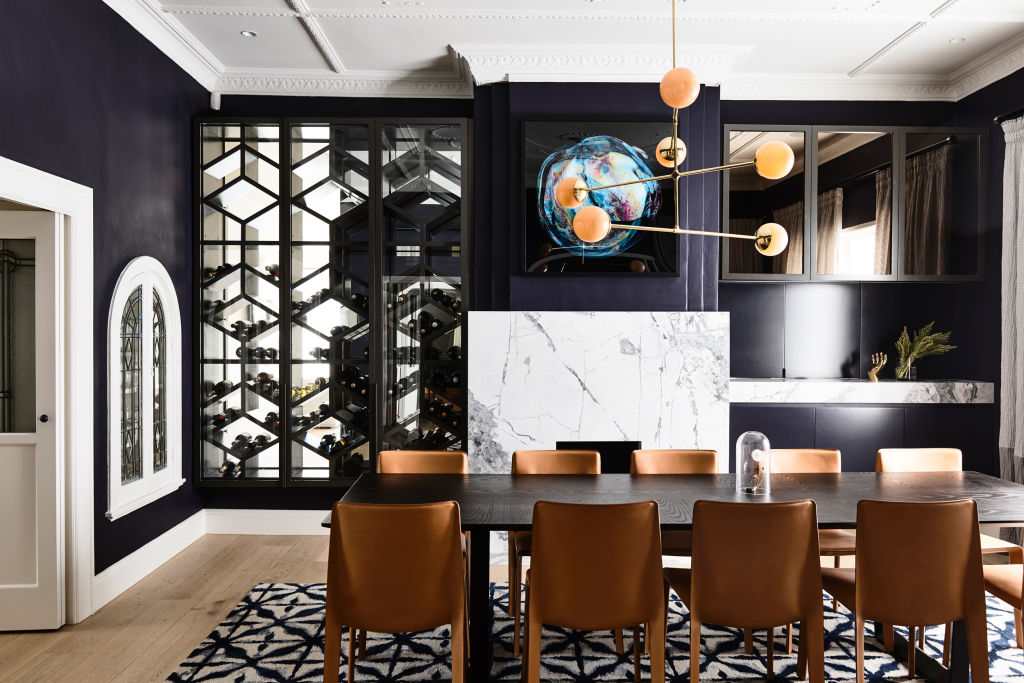 The mirrored wine storage in the dining room makes a glamorous statement. Photo: Derek Swalwell.