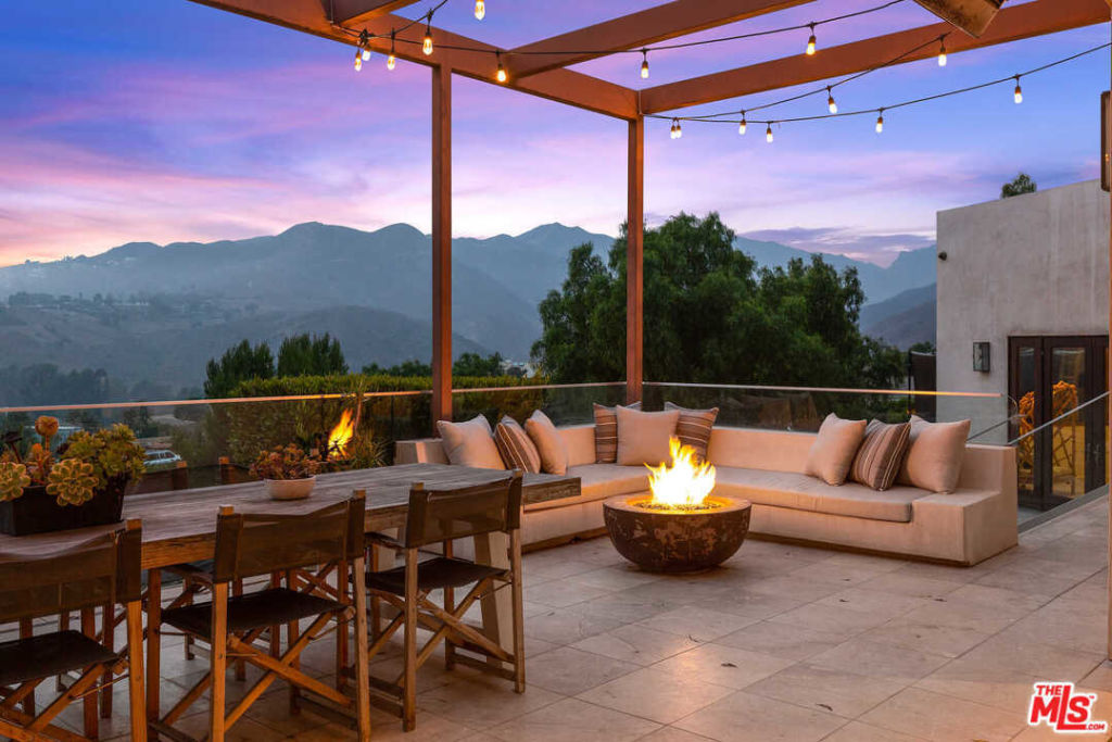 The dining terrace with firepit. Photo: Redfin