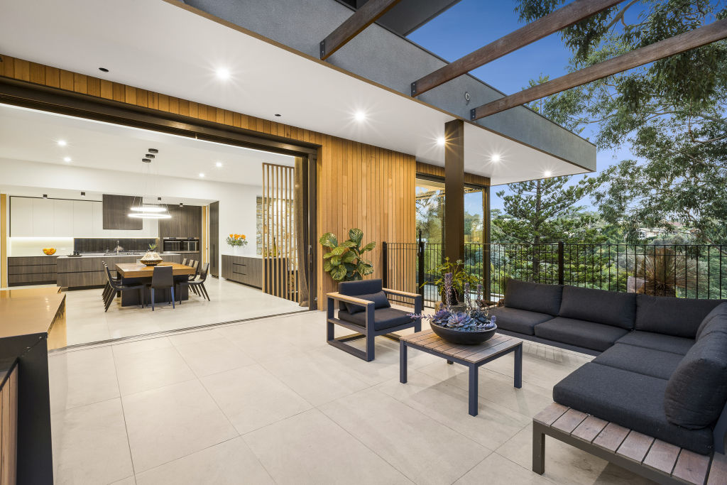 The outdoor entertaining zone with built-in barbecue. Photo: Nicholas Lynch.