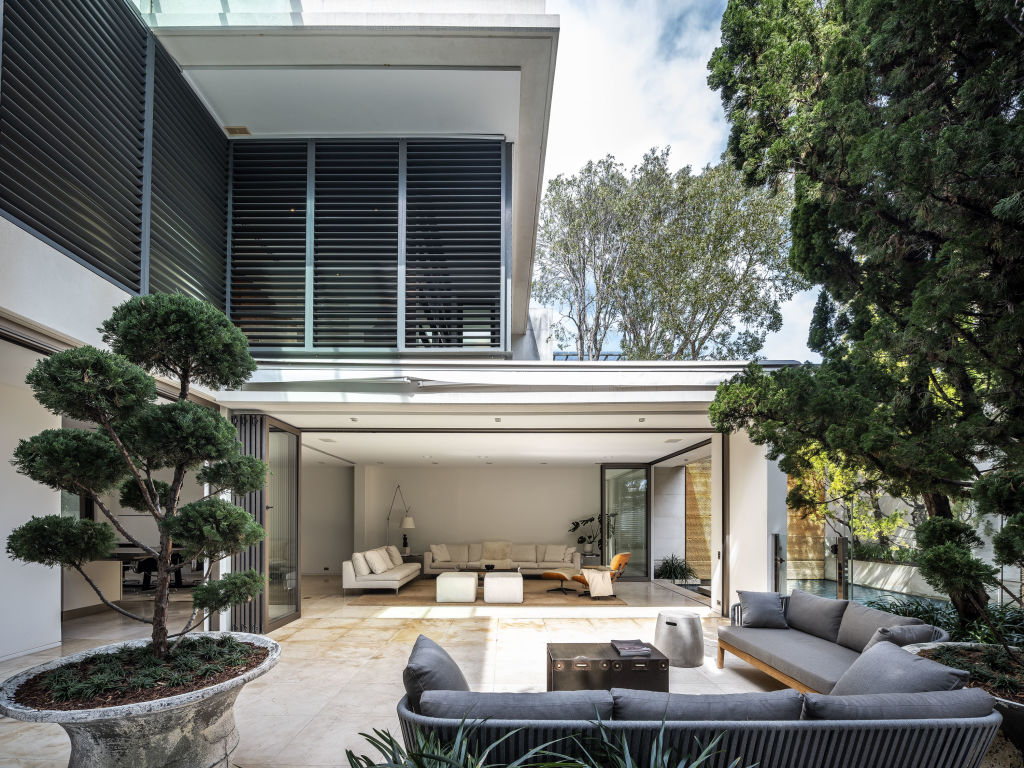 The striking Holdsworth Street residence comes with a showroom garaging and a swimming pool.