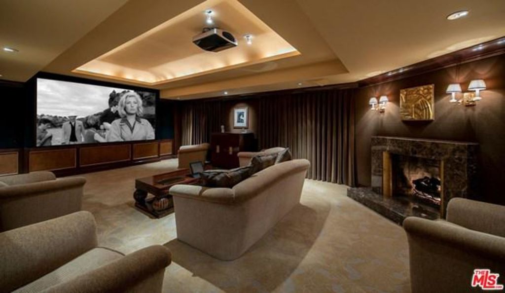 The home theatre has a fireplace. Photo: Remax Collection