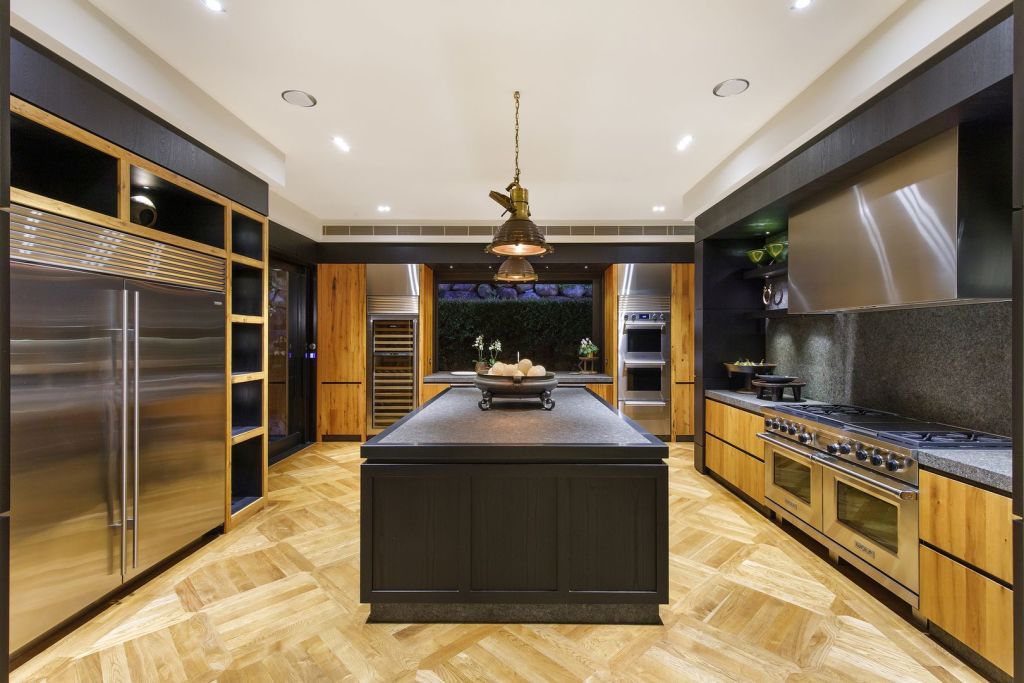 The kitchen includes a leathered granite bench. Photo: Reed & Co