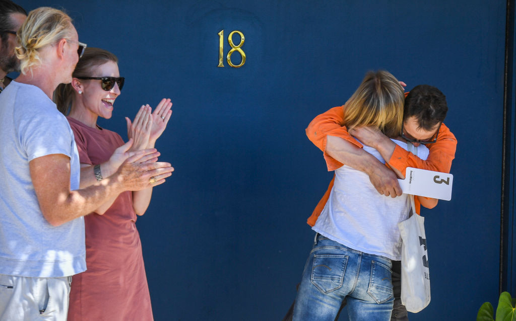 The happy buyers after winning the Balmain East auction. Photo: Peter Rae