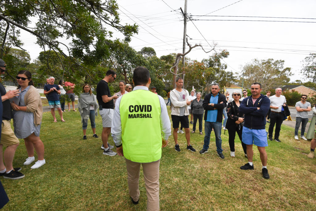 A COVID marshal at the auction. Photo: Peter Rae