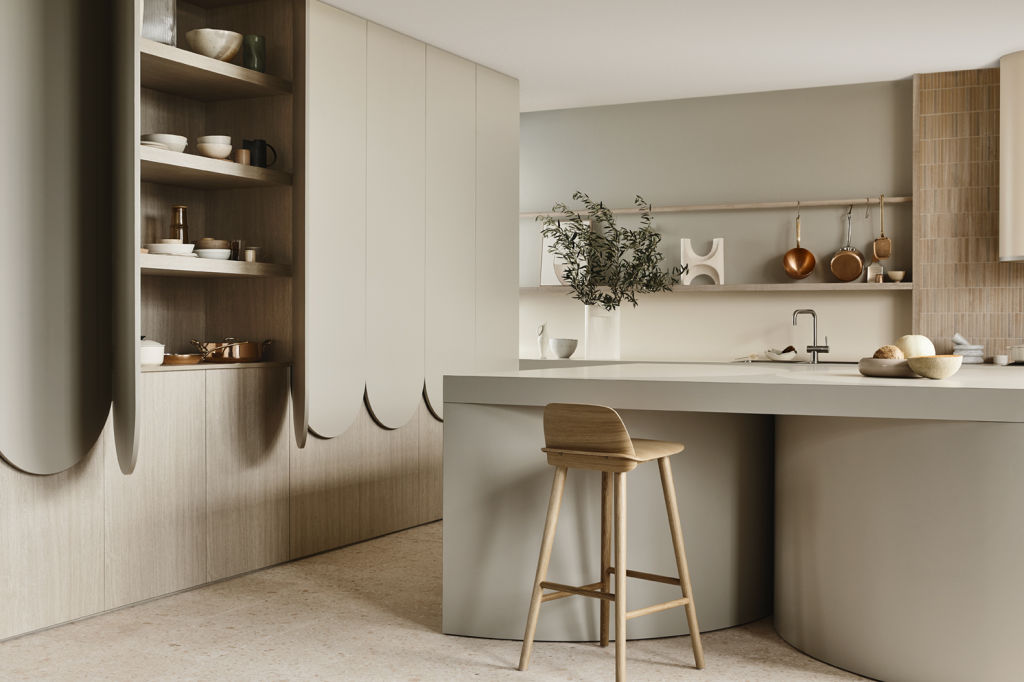 The Expansive Kitchen by Kennedy Nolan. Island, rear benchtop and rangehood: Laminex French Cream. Scallop and rear cabinetry: Laminex Paper Bark. Tower and internal cabinetry: Laminex Whitewashed Oak. Architects: Kennedy Nolan. Photography: Derek Swalwell. Stylist: Natalie James.