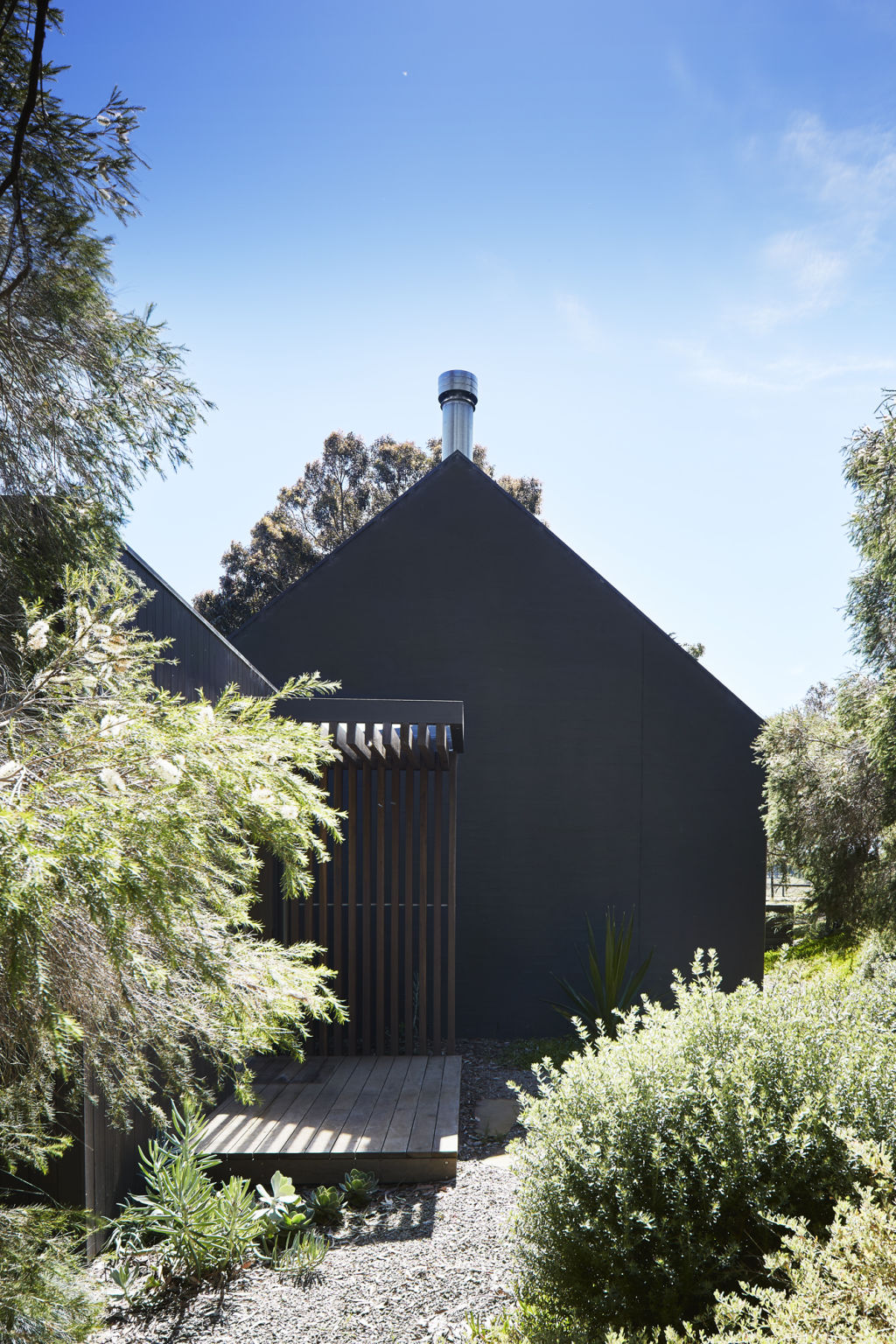 A modern home holds a memory of traditional farmhouse buildings. Photo: Shannon McGrath