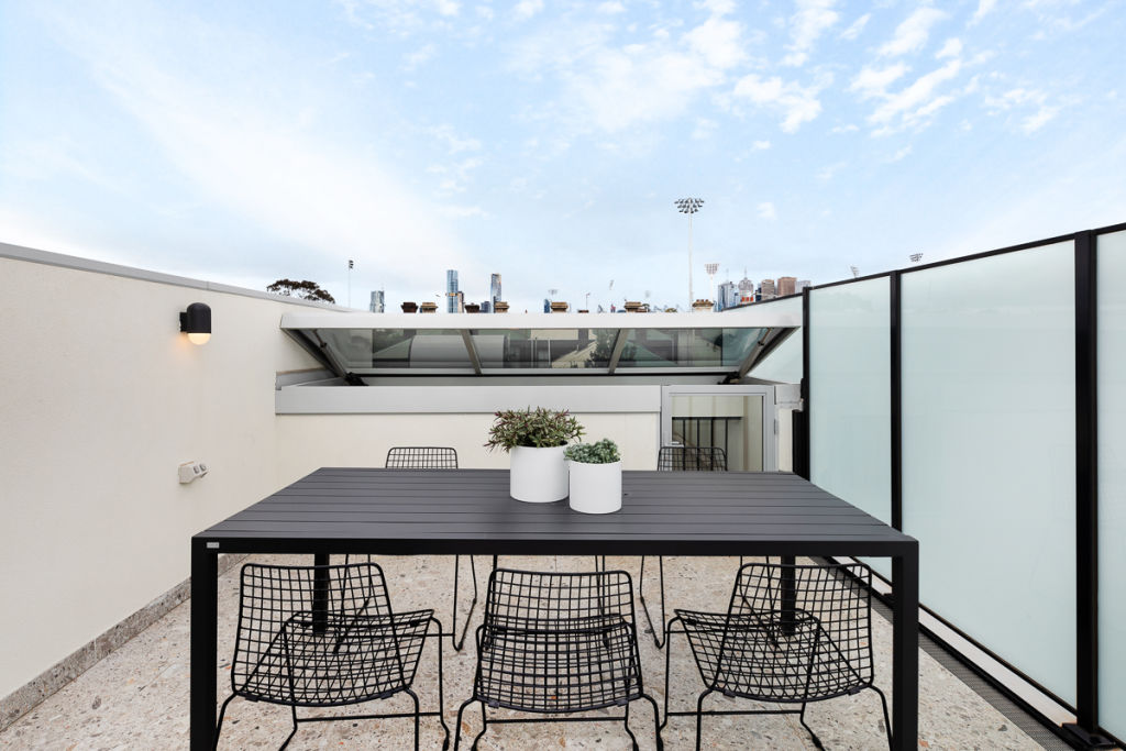 The two-storey townhouse has a rooftop terrace that overlooks the city and the MCG. Photo: Dylan James