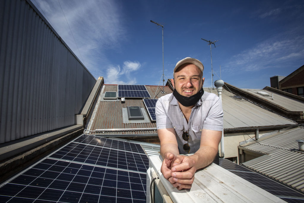 Dan Moss on the roof of his West Melbourne investment property, where he recently had solar panels installed. Photo: Stephen McKenzie