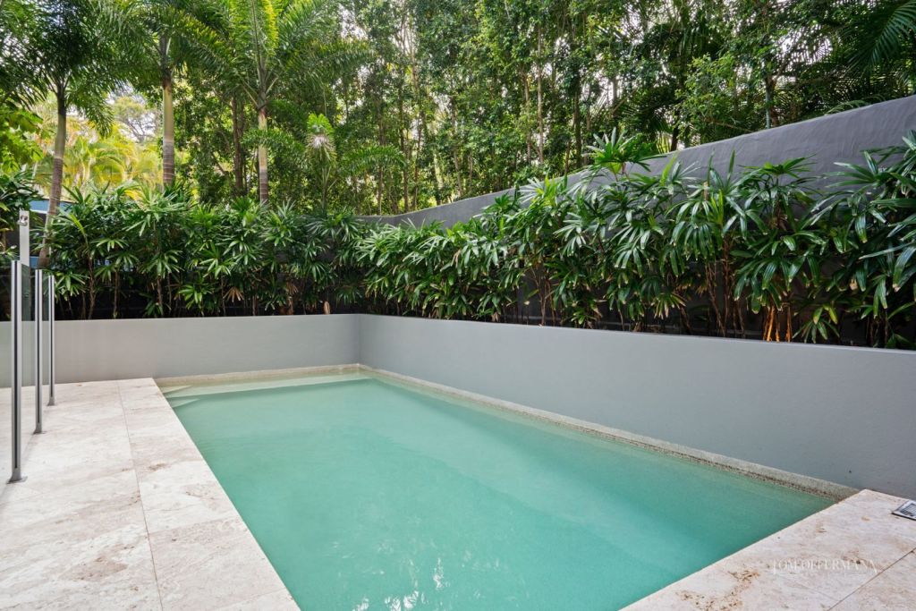 The palm-fringed pool. Photo: Tom Offermann Real Estate