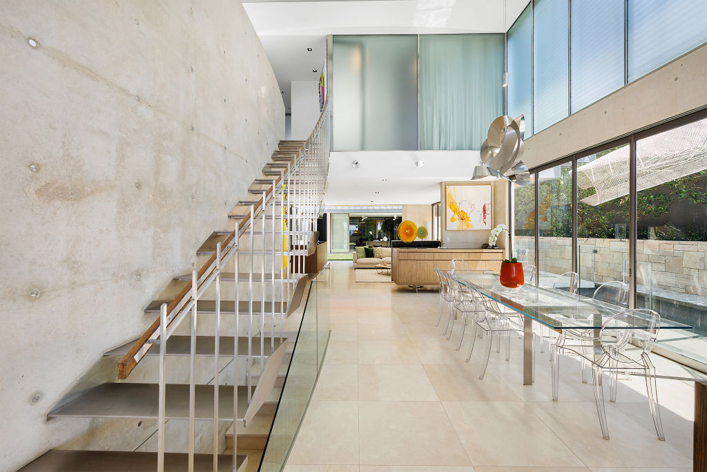 The four-bedroom residence has marble floors and polished concrete walls throughout.