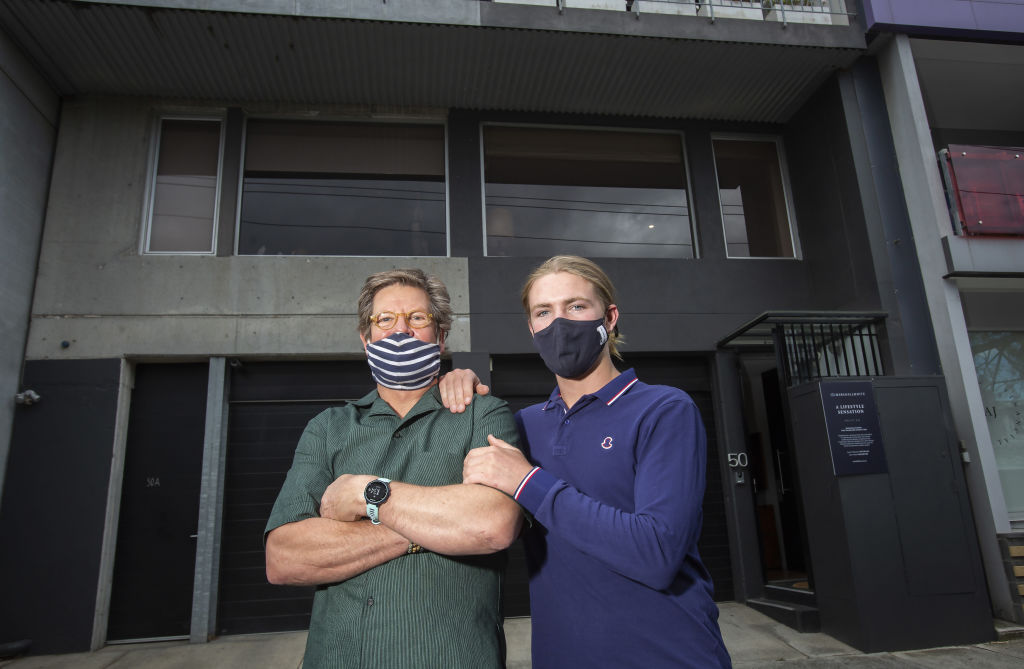 Peter Koren and son Will outside the converted warehouse up for sale. Photo: Stephen McKenzie