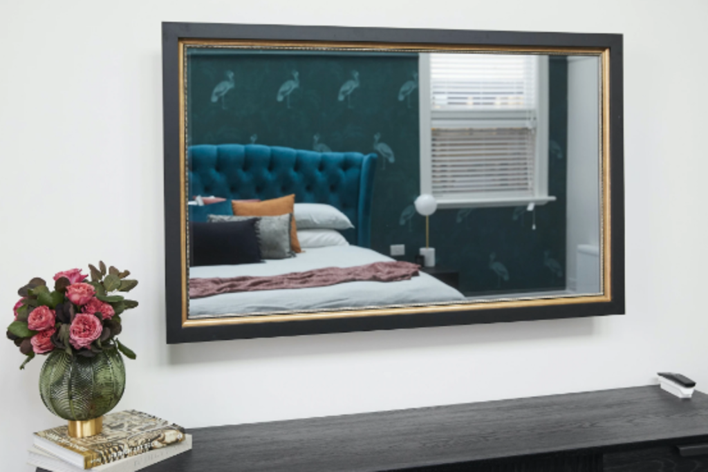 Framing to a T: A TV-mirror with black square frame and gold edging, RRP $5900.