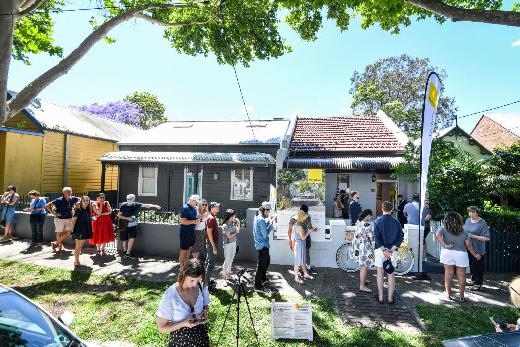 Viewers queue to enter 183 Nelson St, Annandale, before the auction. Photo: Peter Rae