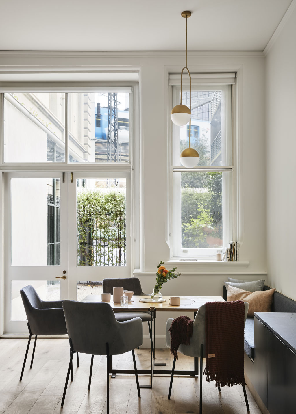A small round table cleverly transforms into a longer square table. Photo: Tess Kelly