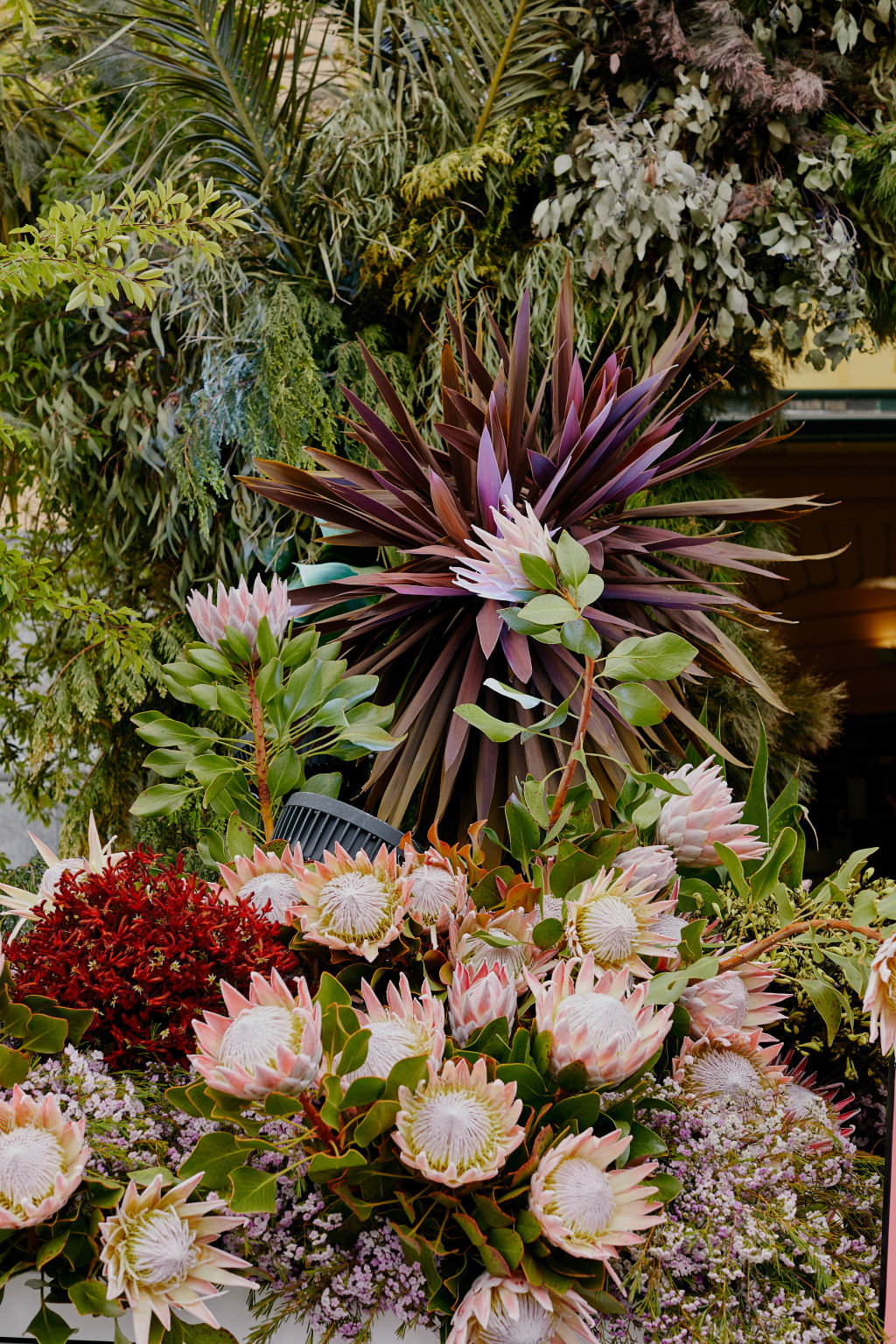 The garden base of the arch at Flinders Street Station, by Flowers Vasette, comprises banksia, kangaroo paw, king protea and towering three-metre tall Acer maple plants. Photo: Amelia Stanwix Photography.